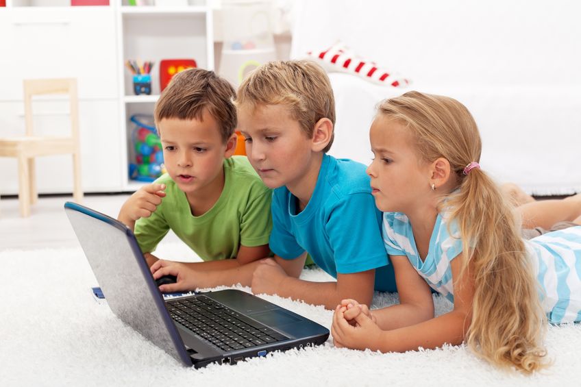 Children sitting at a laptop
